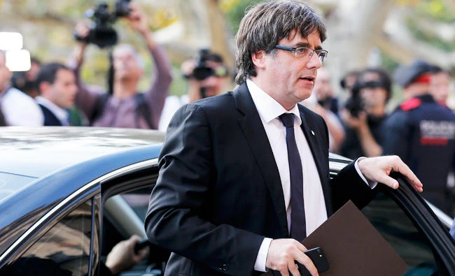 Catalan regional government president Carles Puigdemont arrives to address the Catalan regional parliament in Barcelona on Tuesday. (AFP)