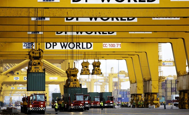 In this file photo taken on Feb. 8, 2009, cranes off load containers at the Jebel Ali port terminal 2 in Dubai, United Arab Emirates. (AP)
