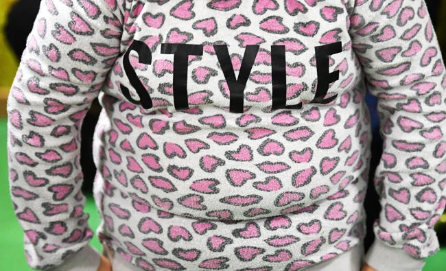 An overweight child wears a sweat-shirt reading the word "Style", in this October 9, 2017 photo, in Postdam, eastern Germany. (AFP)