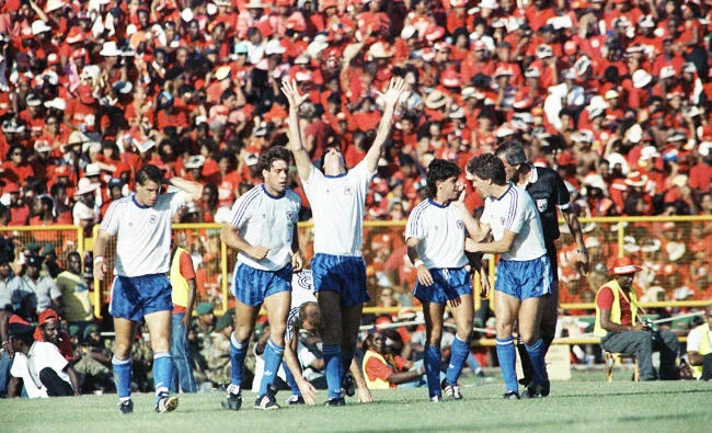 In this Nov. 30, 1989, file photo, From left, United States soccer team players John Harkes, Paul Caligiuri, Bruce Murphy, Tab Ramos and Peter Vermes react following Caligiuri's first half goal against Trinidad and Tobago, in Port-of-Spain, Trinidad. (AP)