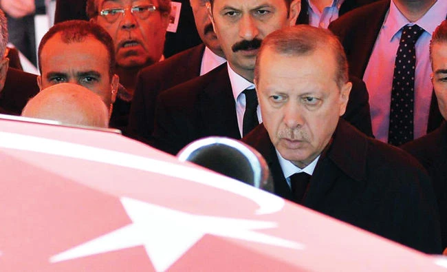 President Recep Tayyip Erdogan attends the funeral of a soldier who died during fighting with the outlawed Kurdistan Workers’ Party (PKK). Ayla Albayrak, a Wall Street Journal reporter, has been sentenced to two years and one month in prison over a 2015 article about clashes between
the army and the PKK. (AFP)