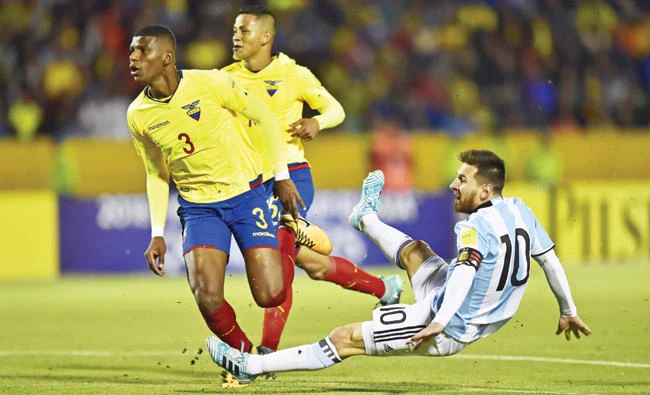 Argentina's Lionel Messi, right, scores his third goal against Ecuador during their
2018 World Cup qualifier football match
in Quito on Tuesday. (AFP)