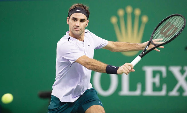 Roger Federer of Switzerland hits a return during his men's 2nd round singles match against Diego Schwartzman of Argentina at the Shanghai Masters tennis tournament in Shanghai on Wednesday. (AFP)