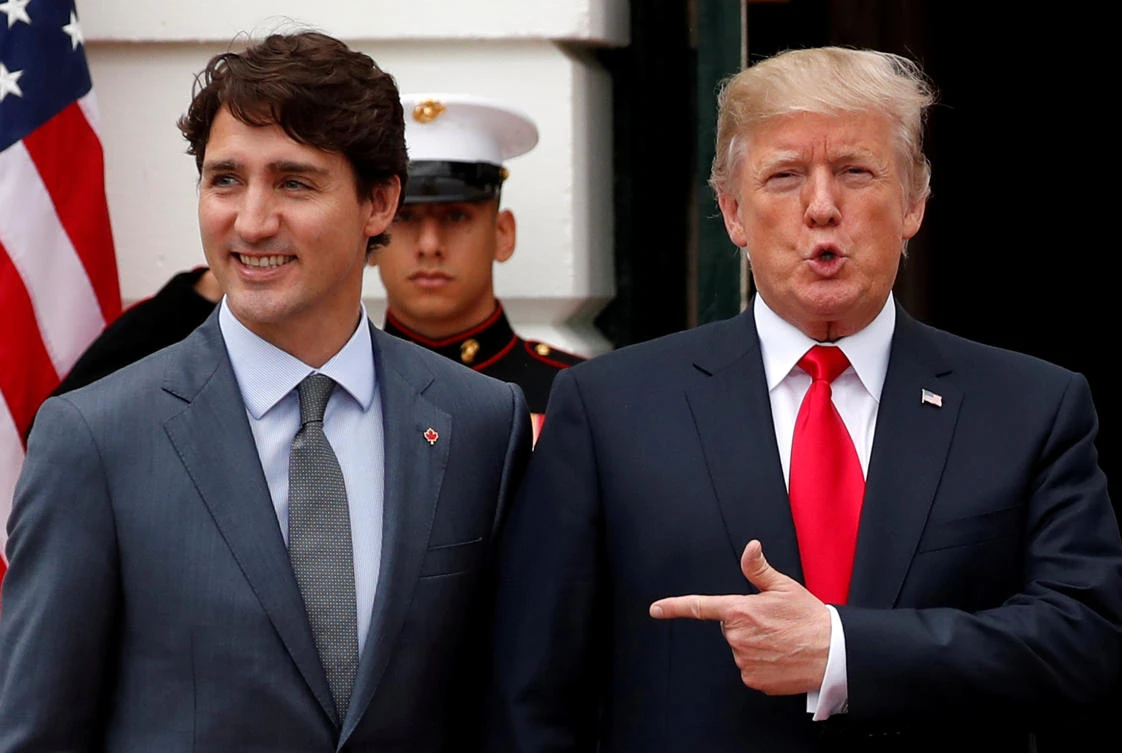 US President Donald Trump welcomes Canada’s Prime Minister Justin Trudeau before their meeting about the NAFTA trade agreement in Washington on October 11. (Reuters)