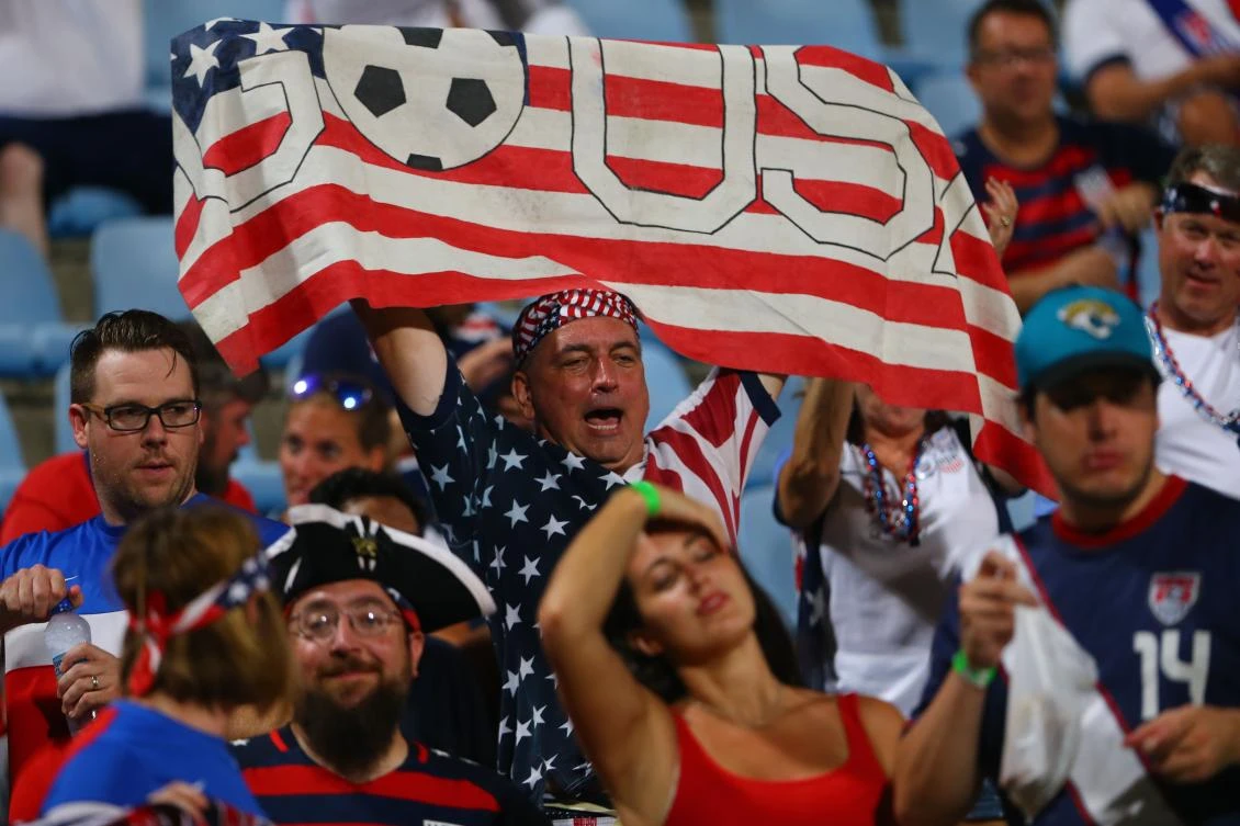 US fans cheer during the FIFA World Cup Qualifier match between Trinidad and Tobago at the Ato Boldon Stadium on October 10. (AFP)