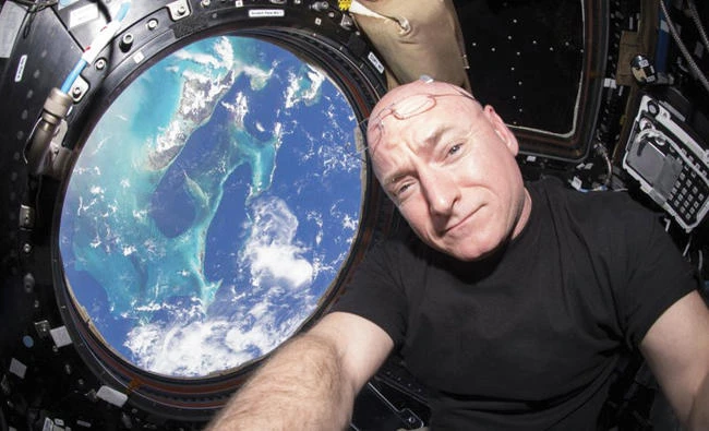 Astronaut Scott Kelly takes a photo of himself inside the Cupola, a special module of the International Space Station which provides a 360-degree viewing of the Earth and the station. (AP)