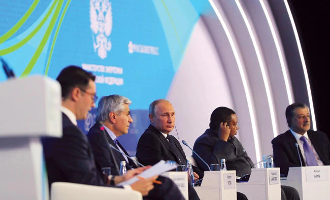Russian President Vladimir Putin, OPEC Secretary General Mohammed Barkindo and other participants attend the Russian Energy Week 2017 forum in Moscow. The IEA said yesterday that both Russia and Saudi Arabia havea strong incentive to support prices by limiting supply. (AP)