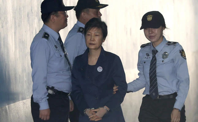 Former South Korean President Park Geun-hye arrives for her trial at the Seoul Central District Court in Seoul on Friday, Oct. 13, 2017. (Shin Jun-hee/Yonhap via AP)