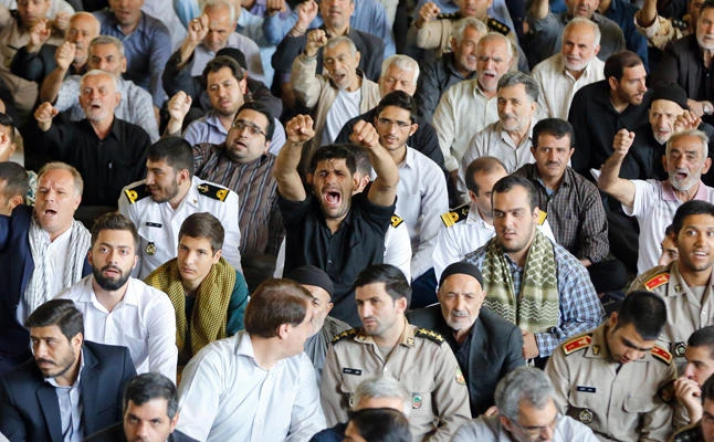 Iranian worshippers shout anti-US slogans during the weekly Friday prayer in Tehran on Friday, October 13, 2017. (AFP)
