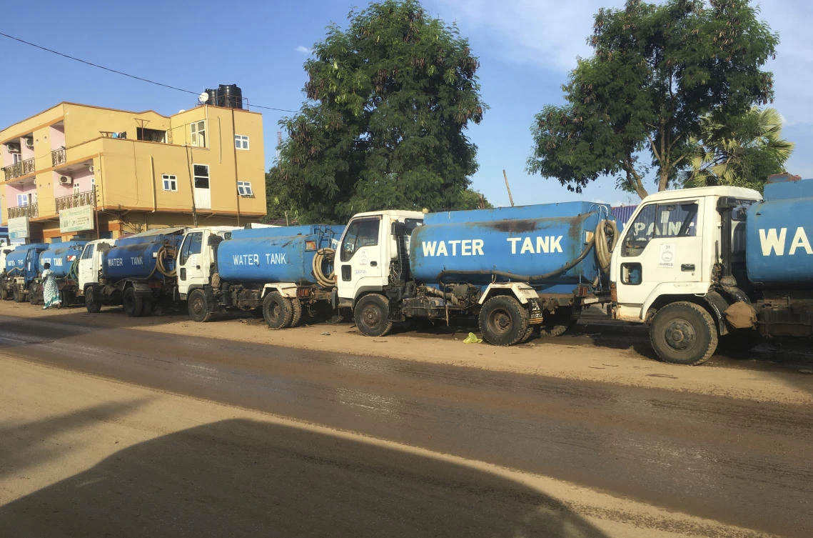 Trucks wait in line for days at a petrol station in South Sudan's capital of Juba in this Oct. 1 file photo. (AP)