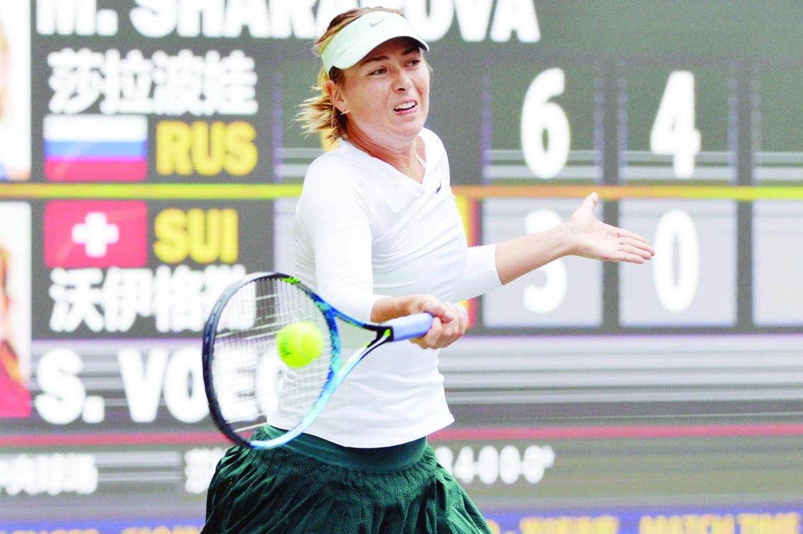 Maria Sharapova of Russia returns a shot against Stefanie Voegele of Switzerland during their match in the WTA Tianjin Open in northeastern China’s Tianjin Municipality on Friday. (AP)