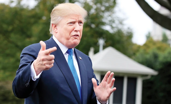 President Donald Trump speaks to reporters at the White House Friday. (AP)