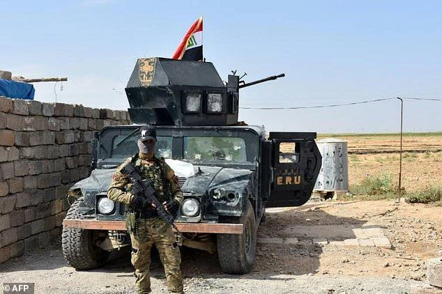 Iraqi troops guard a military position retaken from Kurdish forces in the Kirkuk province town of Taza Khurmatu on October 13, 2017. (AFP)