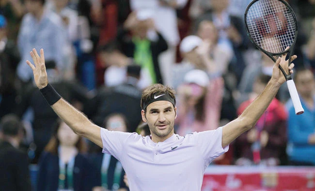 Roger Federer of Switzerland celebrates after winning his men's semifinal singles match against Juan Martin Del Potro of Argentina at the Shanghai Masters tennis tournament in Shanghai on Saturday. (AFP)