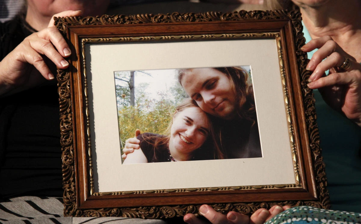 In this June 4, 2014 file photo, mother's Linda Boyle, left and Lyn Coleman hold a photo of their married children, Joshua Boyle and Caitlan Coleman, in Stewartstown, Pa. Pakistan’s military said soldiers have recovered 5 Western hostages held by the Taliban for years saying it worked with U.S. intelligence officials to track down the hostages and free them after discovering they had been brought into Pakistan. Two army officials who spoke to The Associated Press on Thursday, Oct. 12, 2017, identified the hostages as Canadian Joshua Boyle, his American wife Caitlan Coleman and their children who were kidnapped in Afghanistan in 2012. (AP)