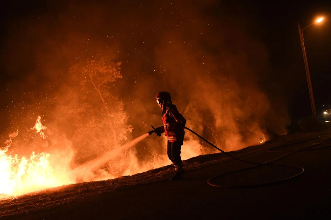 California wildfire evacuees allowed home as crews search for bodies