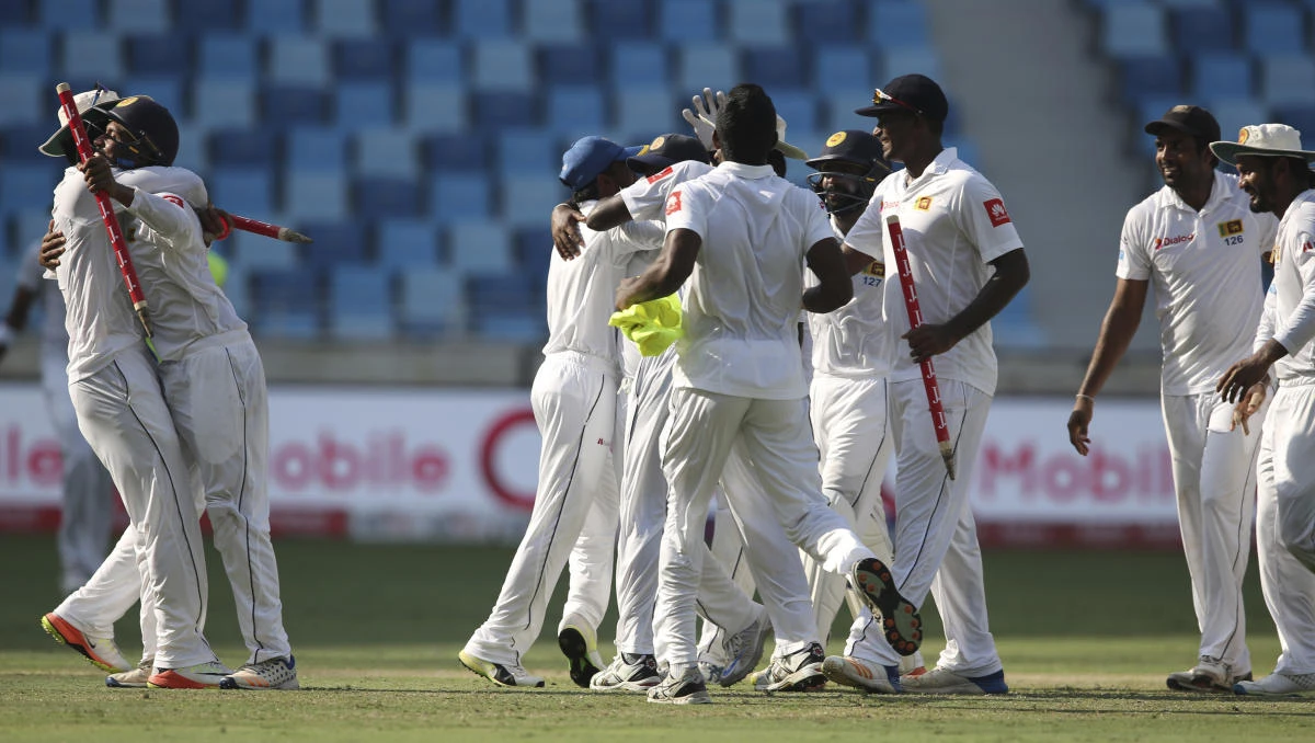 Sri Lanka players celebrate after they beat Pakistan in Second Test cricket match against Pakistan in Dubai, United Arab Emirates, Tuesday, Oct. 10, 2017. (AP/Kamran Jebreili)
