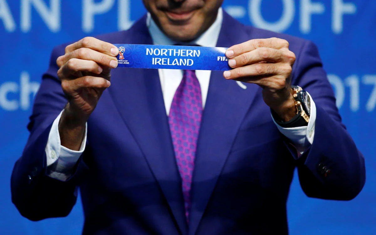 Former Spainish player Fernando Hierro displays the name ‘Northern Ireland’ during the draw (Reuters/Arnd Wiegmann)