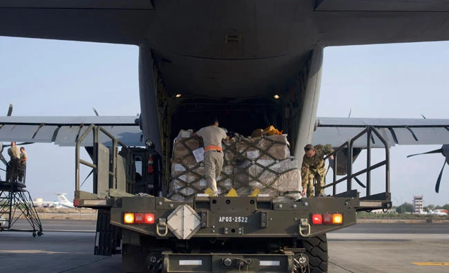 US Airmen from the 449th Air Expeditionary Group load pallets of medical and humanitarian aid supplies, to be delivered to the Somali people, onto a US C-130J Super Hercules at Camp Lemonnier, Djibouti. (AP)