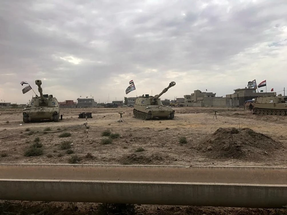 Iraqi tanks deploy in the village of Bashir, south of Kirkuk, Iraq. (AP)