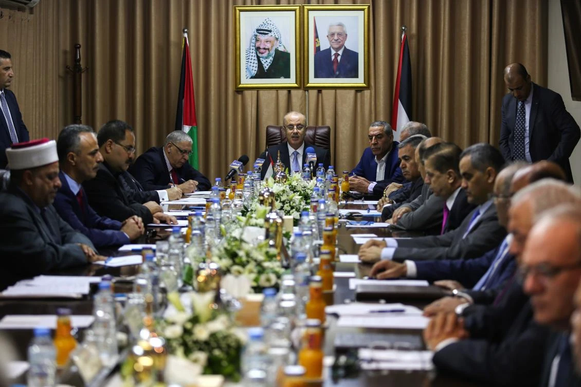 Palestinian Prime Minister Rami Hamdallah (C) chairs a reconciliation government cabinet meeting in Gaza City on October 3, 2017. (AFP)