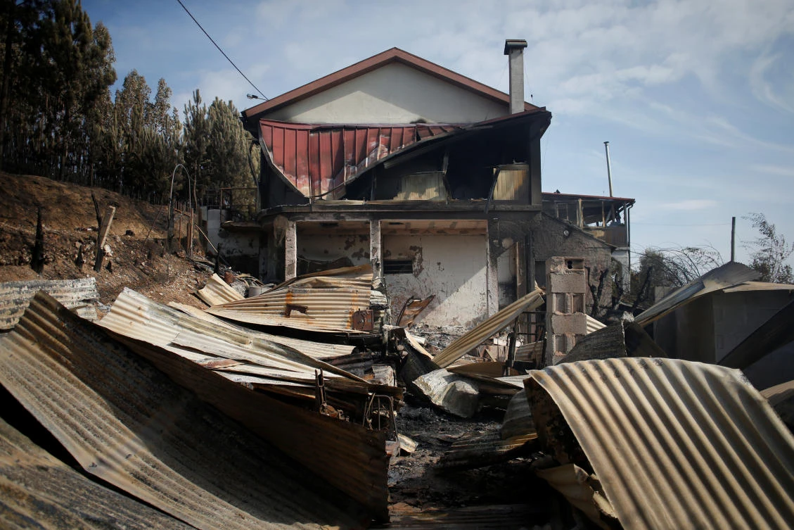 A burnt house is seen after a forest fire in Lagares, near Santa Comba Dao, Portugal October 17, 2017. REUTERS/Pedro Nunes
