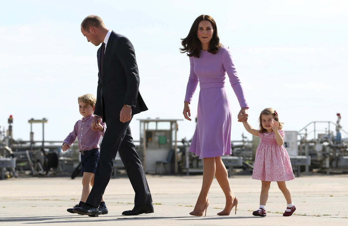 Britain's Prince William and his wife Kate with their children. (AP)