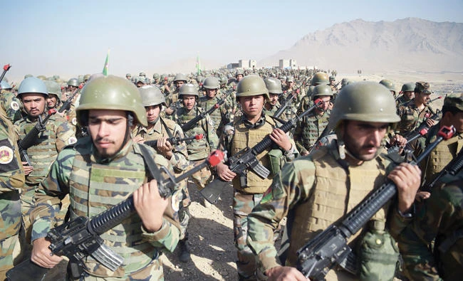 Afghan National Army (ANA) soldiers march during a military exercise on Tuesday at the Kabul Military Training Center (KMTC) on the outskirts of Kabul. (AFP)