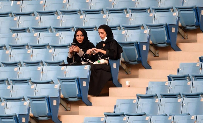 Saudi women sit in a stadium to attend an event in the capital Riyadh, in this September 23, 2017 photo, commemorating the anniversary of the founding of the kingdom. (AFP)