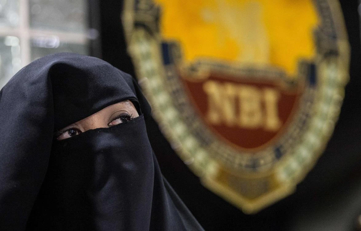 Karen Aizha Hamidon is presented during a press conference at the National Bureau of Investigation in Manila on October 18. Authorities have arrested Hamidon who allegedly used the Internet and social media to recruit Daesh followers around the world. (AFP)