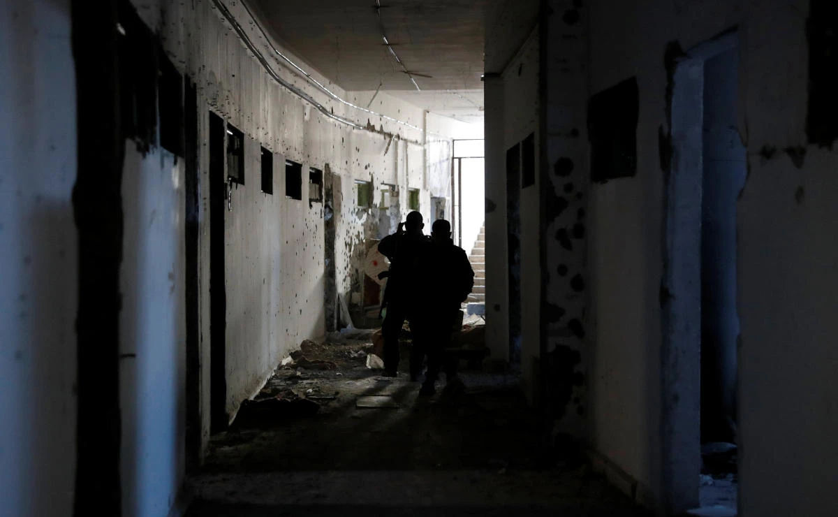 Above, fighters of Syrian Democratic Forces inspect the bunker of the Daesh militants under a stadium in Raqqa, Syria on October 18. (Reuters)
