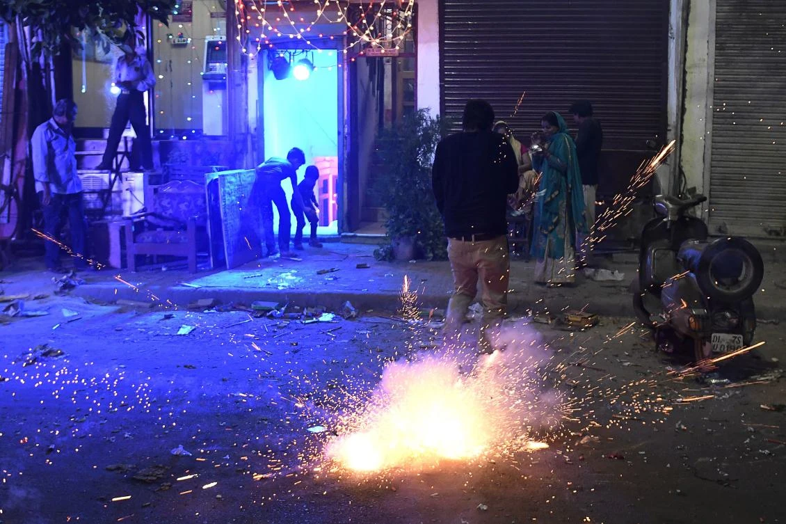 Above, Indian people use firecrackers celebrating Diwali despite the ban imposed by the Supreme Court of India to control the air pollution in New Delhi. (AFP)