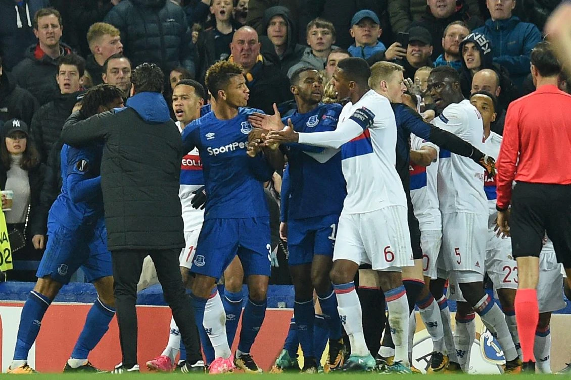 Everton’s English-born Welsh defender Ashley Williams, left, is kept apart as players clash during the UEFA Europa League Group E match between Everton and Lyon at Goodison Park, in Liverpool on October 19, 2017. (File photo by AFP)