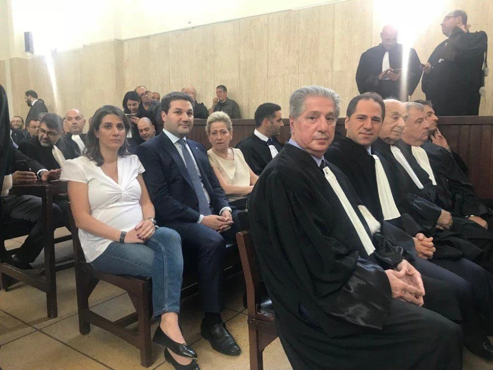 Former Lebanese President Amine Gemayel, front row, left, and his son Sami MP, front row, second left; second row: Solange, third left, Bachir’s children Nadim, second left, and Yumna, left, at the court session in Beirut on Friday.