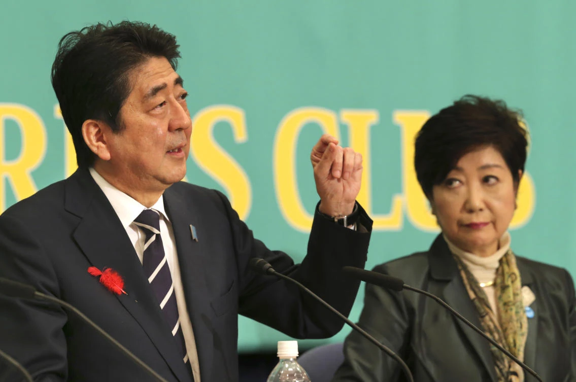 Ruling Liberal Democratic Party leader and Japan’s Prime Minister Shinzo Abe, left, speaks as Party of Hope leader Yuriko Koike, listens during their debate for the lower house election on Sunday. (AP)