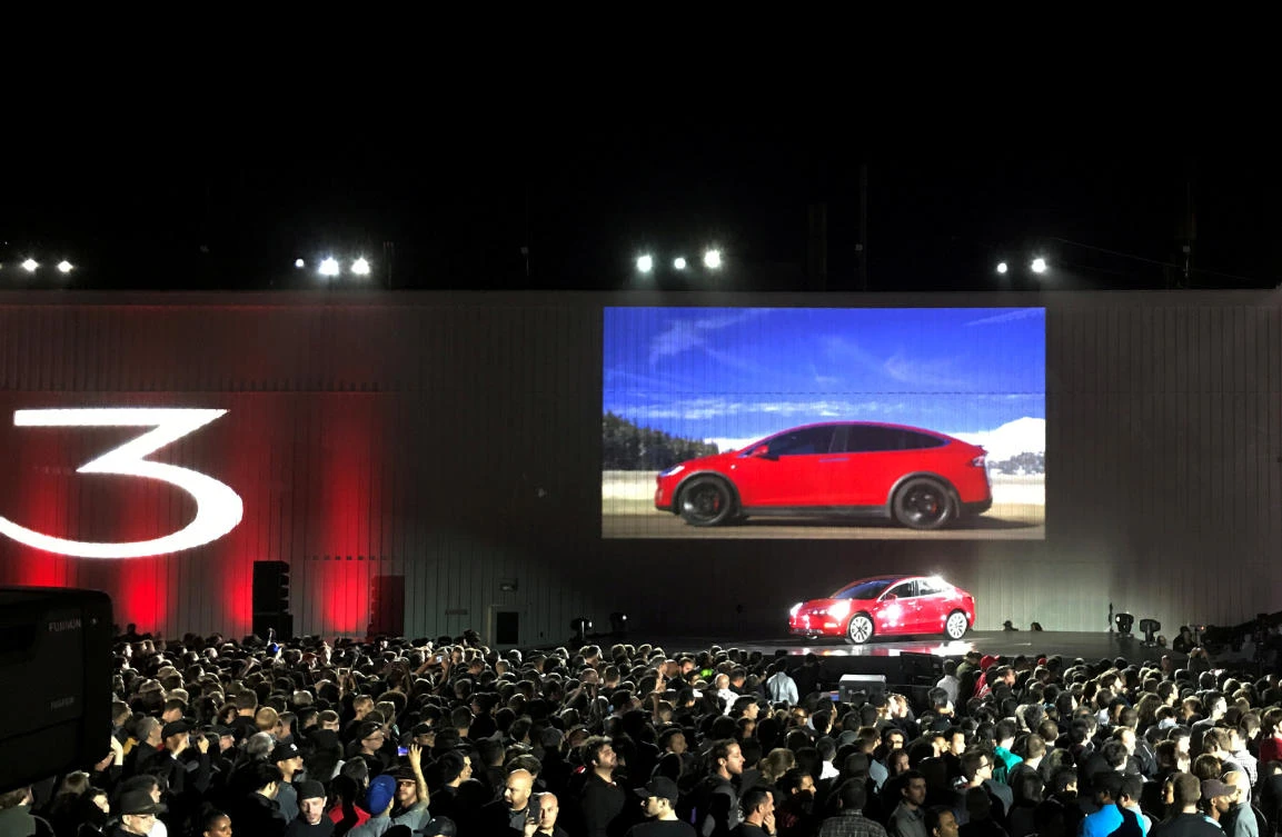 Above, Tesla introduces one of the first Model 3 cars off the Fremont factory’s production line during an event at the company’s facilities in Fremont, California on July 28, 2017. (Reuters)