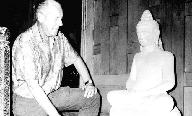 American businessman Jim Thompson views a Buddha statue in Bangkok, Thailand. (AP)