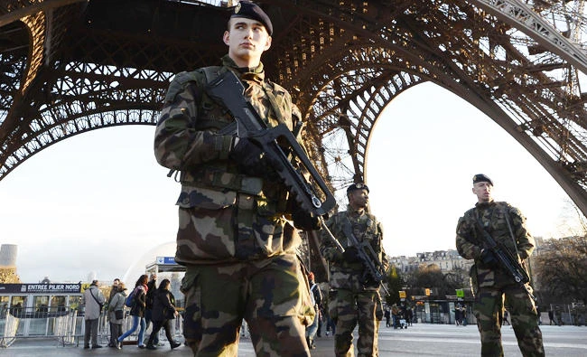 French soldiers patrol in front of the Eiffel Tower, in this January 8, 2015 file photo, in Paris. (AFP)