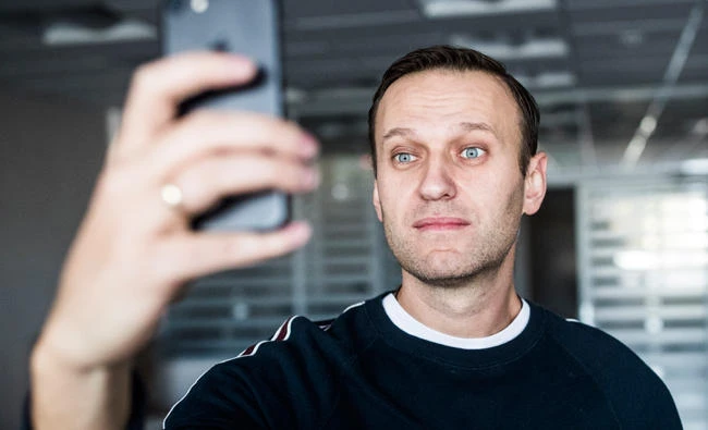 Russian opposition leader Alexei Navalny takes a selfie at his office after been released from a jail in Moscow, on Sunday. (AP)