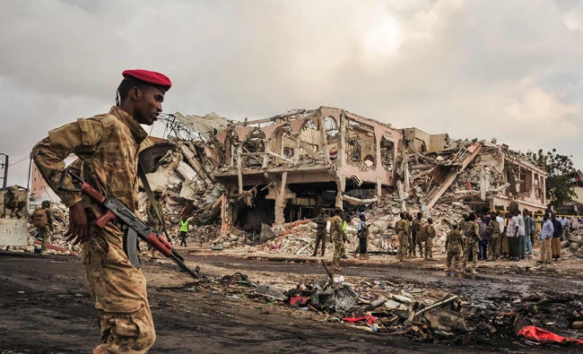 Somali soldiers patroling on the scene of the explosion of a truck bomb in the center of Mogadishu. Somalia's deadliest ever attack, a truck bomb in the capital Mogadishu, that killed at least 358 dead, highlights the fragility of the Somali federal government, analysts said. (AFP)