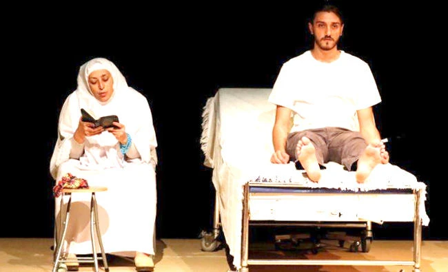 Actors perform during a rehearsal of the play called ‘While I Was Waiting,’ at Dawar Al-Shams theater in Beirut, Lebanon. (Reuters)