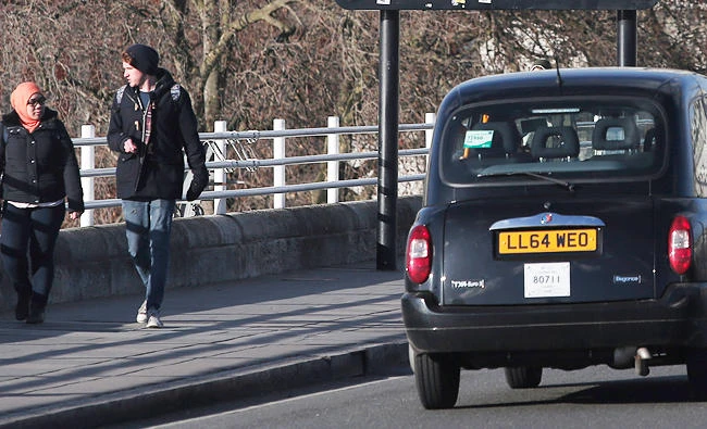 A London taxi driver uses a bus lane on a bridge over the river Thames in central London, in this Jan. 14, 2015 file photo. (AP)