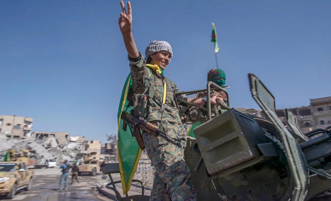Fighters from the Women’s Protection Units (YPJ) celebrate their victory in Raqqa, Syria, on Oct. 19. (AP)
