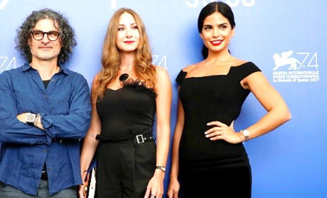 Director Ziad Doueiri, left, poses with actors Rita Hayek, right, and Diamand Bou Abboud during a photocall for the movie ‘The Insult’ in Venice. (Reuters)