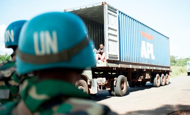 Members of the patrol of the Bangladeshi contingent of the United Nations Multidimensional Integrated Stabilisation Mission in the Central African Republic (MINUSCA) count the trucks arriving at the checkpoint in Baoro along the road between Bouar to Bangui, in this October 15, 2017 photo. (AFP)