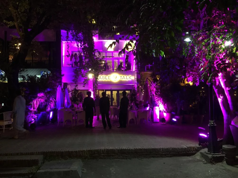 A building lit up in pink to mark Breast Cancer Awareness Month