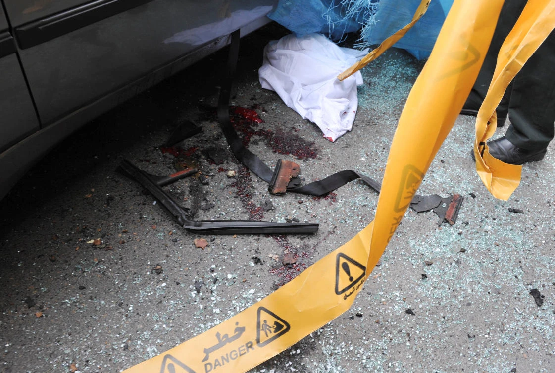 Bloodstains are seen next to the car belonging to Iranian nuclear scientist Mostafa Ahmadi-Roshan at a blast site outside a university in northern Tehran January 11, 2012. (REUTERS/IIPA/Sajad Safari/File Photo)