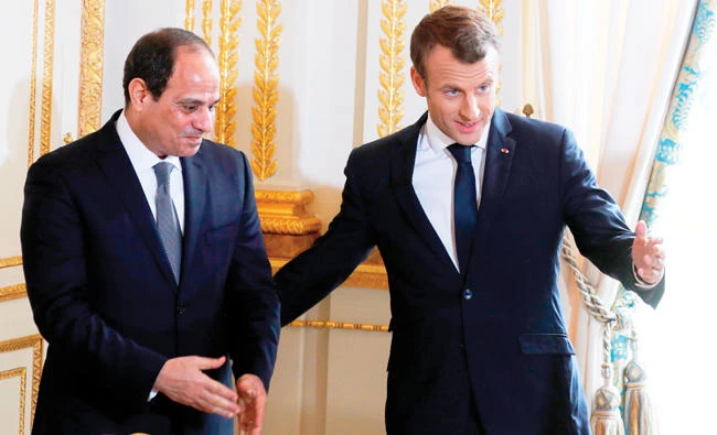French President Emmanuel Macron and Egypt’s President Abdel Fattah El-Sisi at the Elysee Palace in Paris on Tuesday. (AFP)