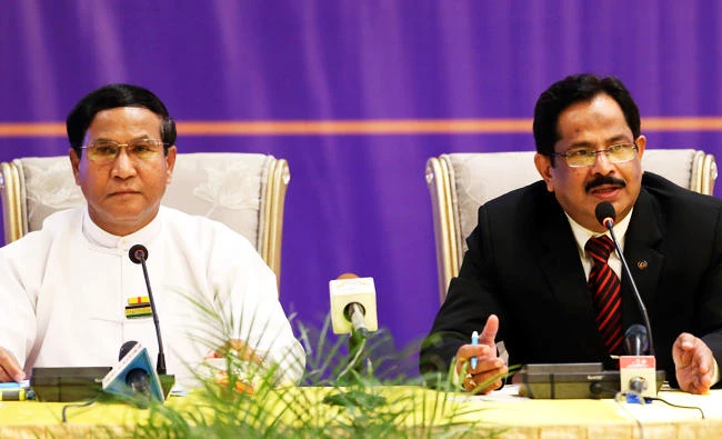 Bangladesh's Home Secretary Mostafa Kamal Uddin, right, and Tin Myint, permanent secretary of Myanmar's Ministry of Home Affairs, left, talks to journalists during their press conference at a hotel in Naypyitaw, Myanmar, on Tuesday. (AP)