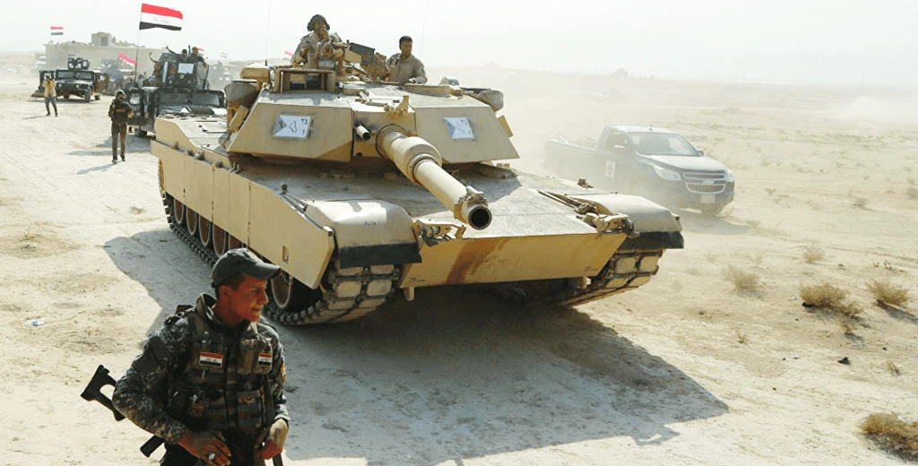 In this file photo, Iraqi forces deploy tanks, artillery in an area held by the Kurdish forces. (Reuters)